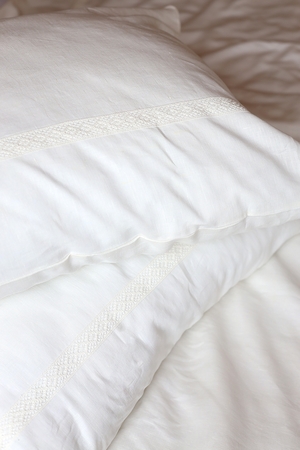 The 100% linen pillowcase with delicate bobbin lace was lovingly and carefully designed and sewn in the Czech Podkrkonoší